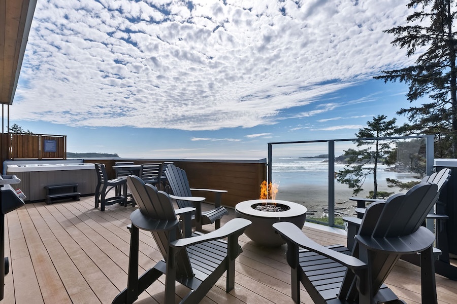 Step out onto your Pacific Sands oceanview balcony and soak in your own private hot tub and fire pit, complete with jaw-dropping 180-degree views of Cox Bay.
