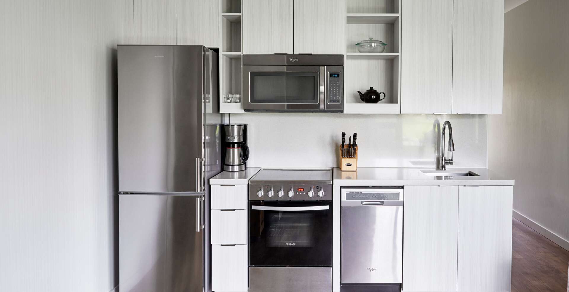 Fully-equipped kitchen in an Oceanside suite.