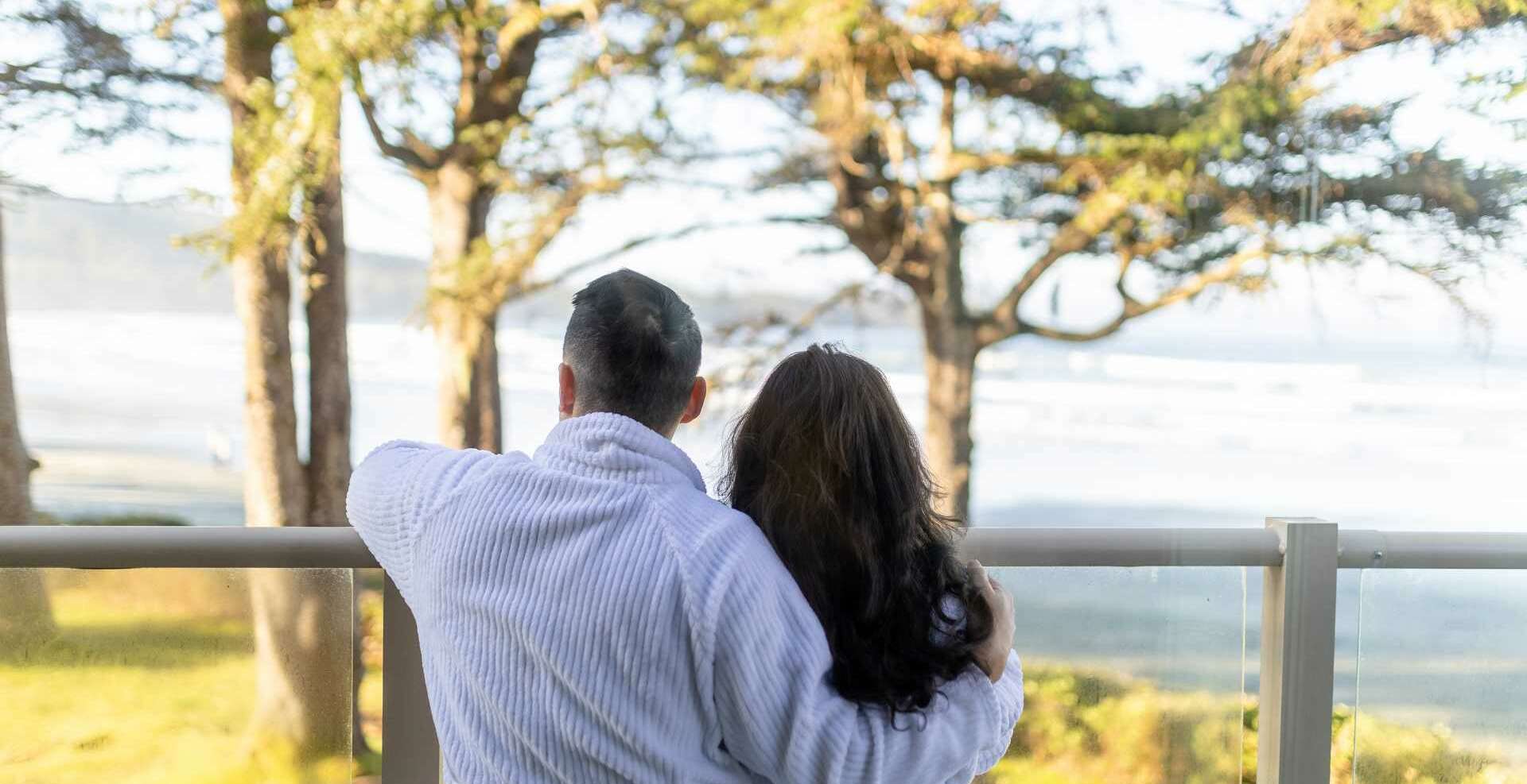Diverse Couple Take In Views from Sand Dollar Suite