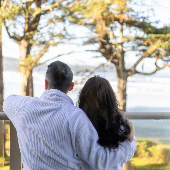 Diverse Couple Take In Views from Sand Dollar Suite